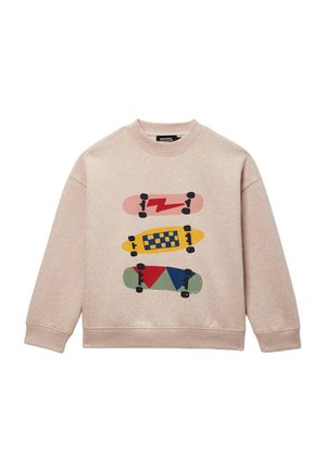 Sweat-shirt beige avec trois graphismes colorés de skateboard en rose, jaune et vert, chacun présentant des motifs différents et des roues noires.