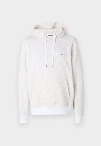 Cream hoodie with a textured geometric pattern, featuring a front pocket, white drawstrings, and ribbed cuffs and hem. Logo on chest.