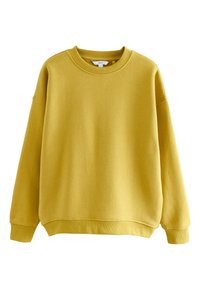 Žuta majica dugih rukava s okruglim izrezom na vratu, spuštenim ramenima te rebrastim manžetama i rubom. Izrađena od mekanog, teksturiranog materijala.