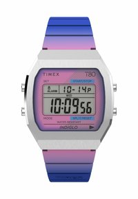 L'orologio digitale Timex T80 presenta una cassa in acciaio inox silver, un quadrante a gradiente rosa e un cinturino in silicone blu-viola. Design resistente all'acqua.