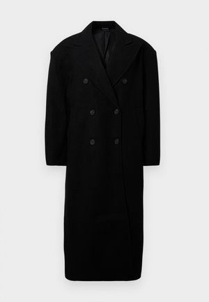 Mustassa villasekoitteessa on kaksirivinen takki, jossa on suuret liepeet, kuusi nappia ja sivutaskut. Suora leikkaus, jossa on olkapäällysteet.