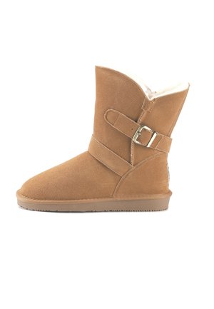 Brown suede ankle boot with a buckle strap, soft interior lining, and a flat rubber sole, featuring a rounded toe and a slightly flared top.