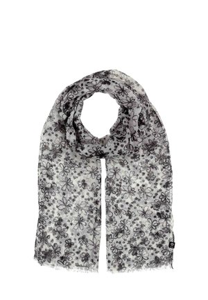 Écharpe florale légère avec un fond blanc et des motifs de fleurs noirs. Les bords sont frangés, offrant une finition texturée.