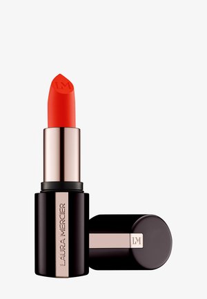Red lipstick in a sleek, black tube with a metallic rose gold accent. Features a pointed tip embossed with "LM."