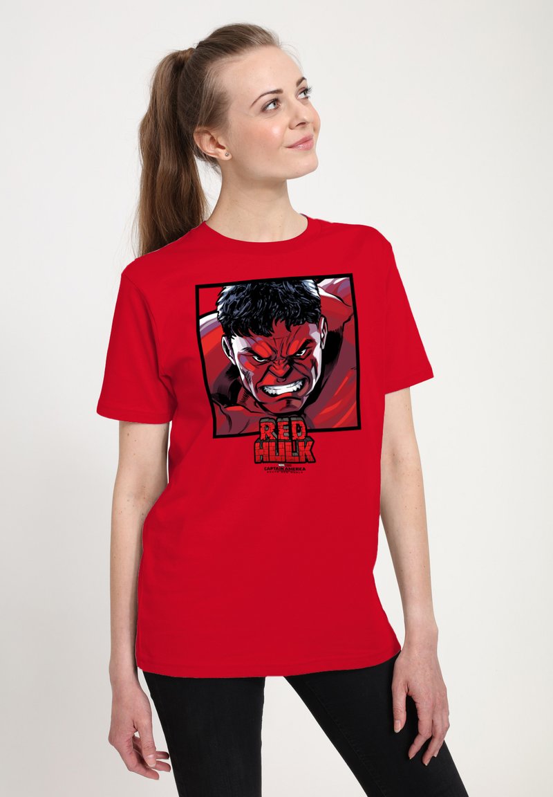 Red t-shirt featuring a graphic of a character with an angry expression, black hair, and the text "RED HULK" underneath in bold lettering.