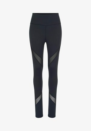 Mustat legginsit, jotka on valmistettu joustavasta kankaasta ja joissa on verkkopaneeleja sivuilla, korkealla vyötäröllä ja muotoilultaan tiukoilla.