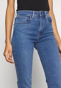 Levi's® 725™ HIGH RISE BOOTCUT - Calças de ganga bootcut - blue denim