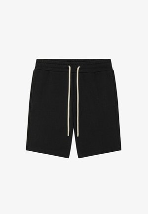 Shorts noirs en tissu jersey avec une coupe décontractée, dotés d'une ceinture à cordon de serrage dans une couleur beige clair contrastante.
