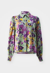 Blouse fleurie avec une base verte, ornée de motifs violets, jaunes et roses. Manches longues avec des poignets froncés et un col.