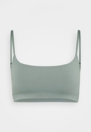 Svijetlozeleni bralette izrađen od glatkog, rastezljivog materijala. Ima tanke podesive naramenice i zaobljeni dekolte s jednostavnim, čistim dizajnom.