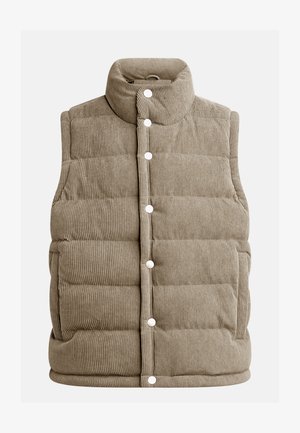 Beežist korduroy-vest, tikandiga disain, kõrge krae, nööbid, küljetaskud ja vertikaalne ribateksuur.