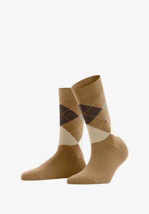 Brown argyle socks featuring a mix of beige, cream, and dark brown diamond patterns, with a small logo on the outer side.
