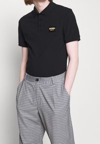 MOSCHINO Piké - black