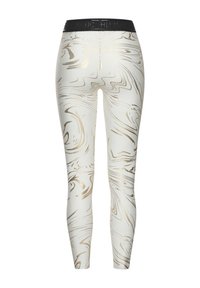 Leggings mit einem weißen Grund und wirbelnden goldenen Mustern, einer hohen Taille und einem glänzenden schwarzen Bund mit Branding.