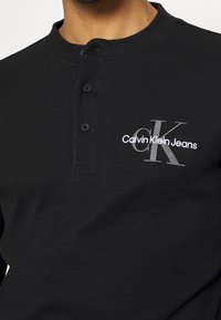 Calvin Klein Jeans Top s dlouhým rukávem - black