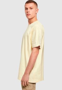 Merchcode FAITH - T-shirts print - softyellow