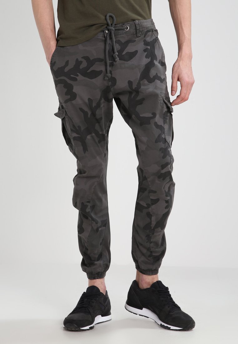 Camouflage cargo pants in shades of gray, featuring a drawstring waist, side pockets, tapered legs, and elastic cuffs.