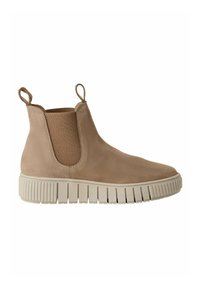 Bottines chelsea beiges avec une tige en daim lisse, des panneaux latéraux élastiques et une semelle en caoutchouc texturée dotée de rainures horizontales prononcées.