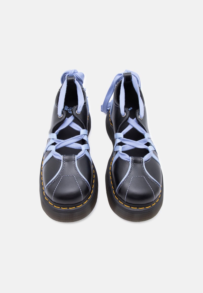 Black leather boots with light purple crisscross laces, yellow stitching on thick soles, shown from the front on a white background.