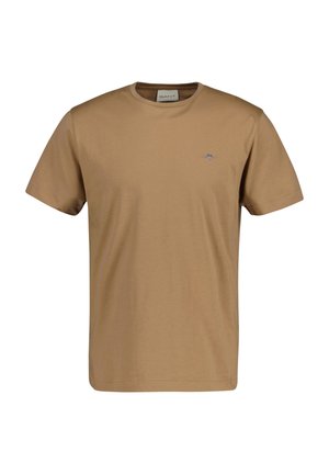 T-shirt homme uni marron à manches courtes avec col rond, petit logo de la marque sur le côté gauche de la poitrine et étiquette visible à l'intérieur du col.