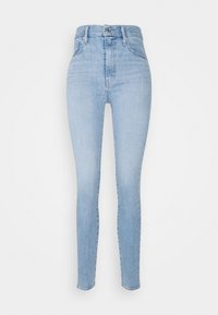 Jeans skinny de talle alto en azul claro, hechos de denim, con un diseño clásico de cinco bolsillos, cremallera y una sutil textura desteñida.
