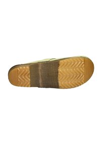 Green rubber sole with a textured pattern, featuring a wooden section at the center. Slightly curved shape and reinforced edges.