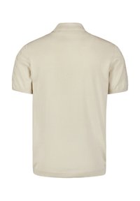 Beige polo shirt met korte mouwen, met een klassieke kraag en zigzagstiksel detail op de schouders. Glad textuur.
