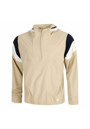 Impermeabile beige con mezza cerniera, polsini elasticizzati e blocchi di colore nero e bianco su spalle e parte superiore delle maniche.