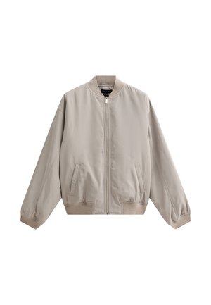 Ljust beige bomberjacka i mjukt tyg, med dragkedja fram, två sidofickor och ribbade manschetter och nederdel.