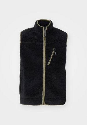 Black fleece vest with a high collar, olive green accents, front zipper, and a left chest pocket with a zipper. Soft, textured fabric.