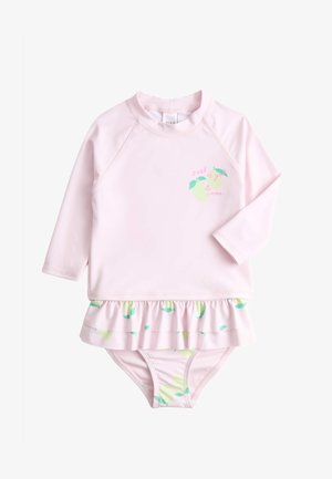 Jasnoróżowy, długi rękaw, dziecięcy kombinezon kąpielowy z falbaną w formie spódniczki, zielonymi nadrukami cytryn oraz małym napisem na piersi.