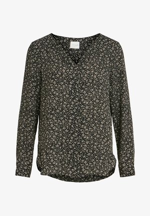 Blusa negra de manga larga con escote en V, con un patrón moteado blanco por toda la prenda. Hecha de una tela suave con un dobladillo ligeramente curvado.
