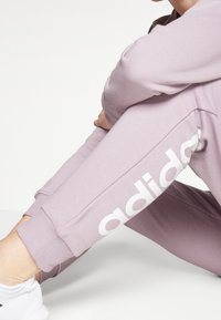 adidas Sportswear Verryttelyhousut - purple