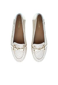 Woven leather loafers in metallic silver with a round toe, gold hardware accents, and a textured finish. Lined interior and flexible sole.