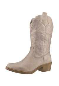 Bota de cowboy en ante beige con costuras decorativas y punta afilada. Presenta un tacón bajo y apilado y una suela de contraste.