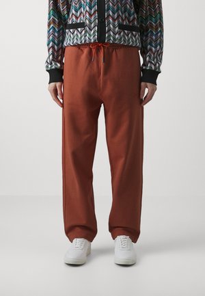 TROUSERS - Tracksuit bottoms - orange