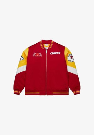 Red bomber jacket with yellow sleeves; features white and yellow stripes, logos on chest and sleeves, and ribbed cuffs and hem.