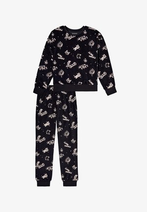 Black pajama set with long-sleeve top and pants. Soft velour fabric with white playful printed patterns. Cuffed sleeves and ankles.