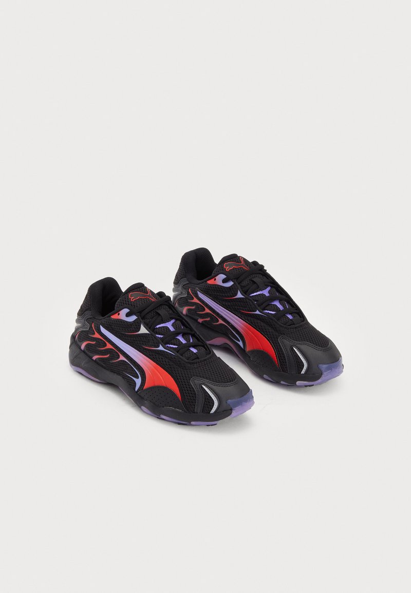 Black athletic sneakers with red and purple accents, featuring a mesh upper, lace closure, and textured rubber soles.
