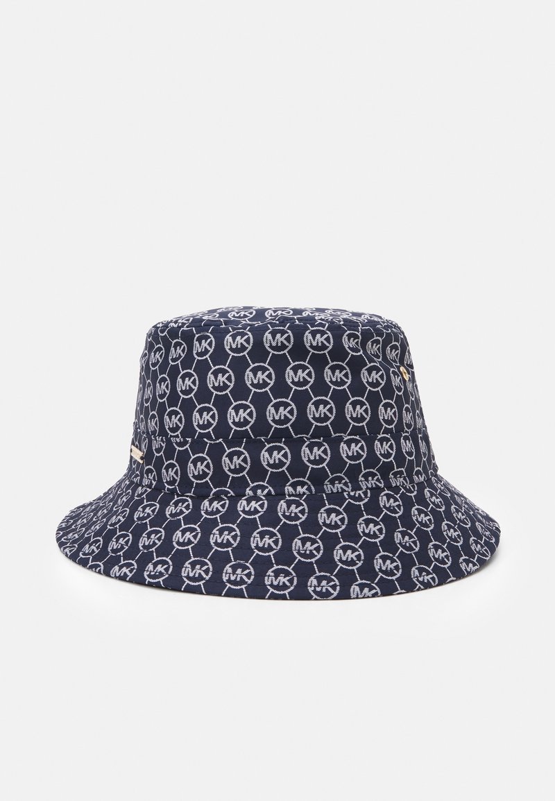 Bob bleu marine avec un motif de cercles blancs interconnectés sur l’ensemble, avec les initiales « MK », œillets métalliques sur le côté et une bordure lisse.