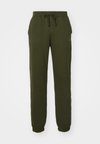 ICONS ELASTIC-CUFF SLIM FIT - Pantaloni sportivi - dark green