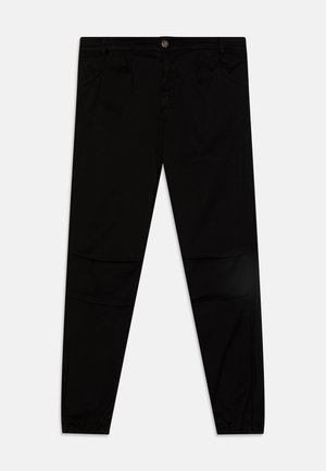 Pantaloni neri realizzati in tessuto elasticizzato. Progettati con una vestibilità aderente, cinque tasche e un polsino alla caviglia regolabile. Presentano una chiusura con bottone in metallo.