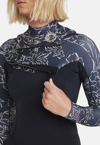 Wetsuit with floral-patterned upper in dark blue and black, featuring a front zip and smooth texture, designed for water activities.