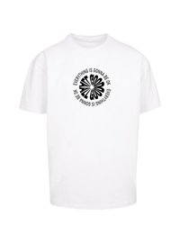 White cotton t-shirt featuring a circular black graphic with the text "Everything is gonna be OK" in a playful, distorted font.