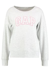 Felpa grigia chiaro con scollatura ampia e maniche raglan, caratterizzata da lettering rosa "GAP" sulla parte anteriore. Texture del tessuto morbida.
