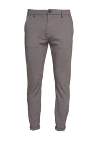 Pantalon gris coupe slim avec fermeture à bouton et zip, passants de ceinture, poches latérales et poignets zippés.