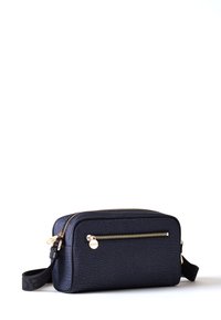 Navy blue textured bag with gold hardware, zippered closure, and a front pocket. Features an adjustable strap for easy carrying.