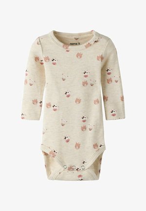 Bombažna bodi majica z dolgimi rokavi v kremni barvi z rebrasto teksturo, z rožnatimi in rjavimi živalskimi vzorci. Zapiranje na spodnjem delu s pritisnimi gumbi za enostavno oblačenje.