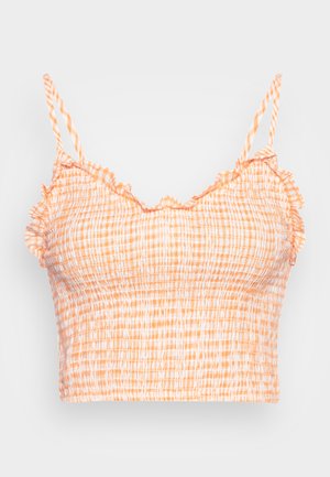 Top cropped pregueado em padrão xadrez laranja e branco, com alças finas e bordas franzidas ao longo do decote para uma textura adicional.