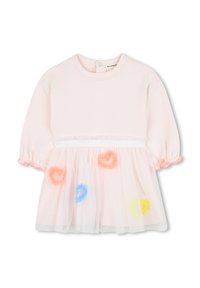 Haut en coton rose avec des manches courtes bouffantes, présentant une superposition en tulle transparent ornée de pompons ronds colorés et d'une ceinture décorative.